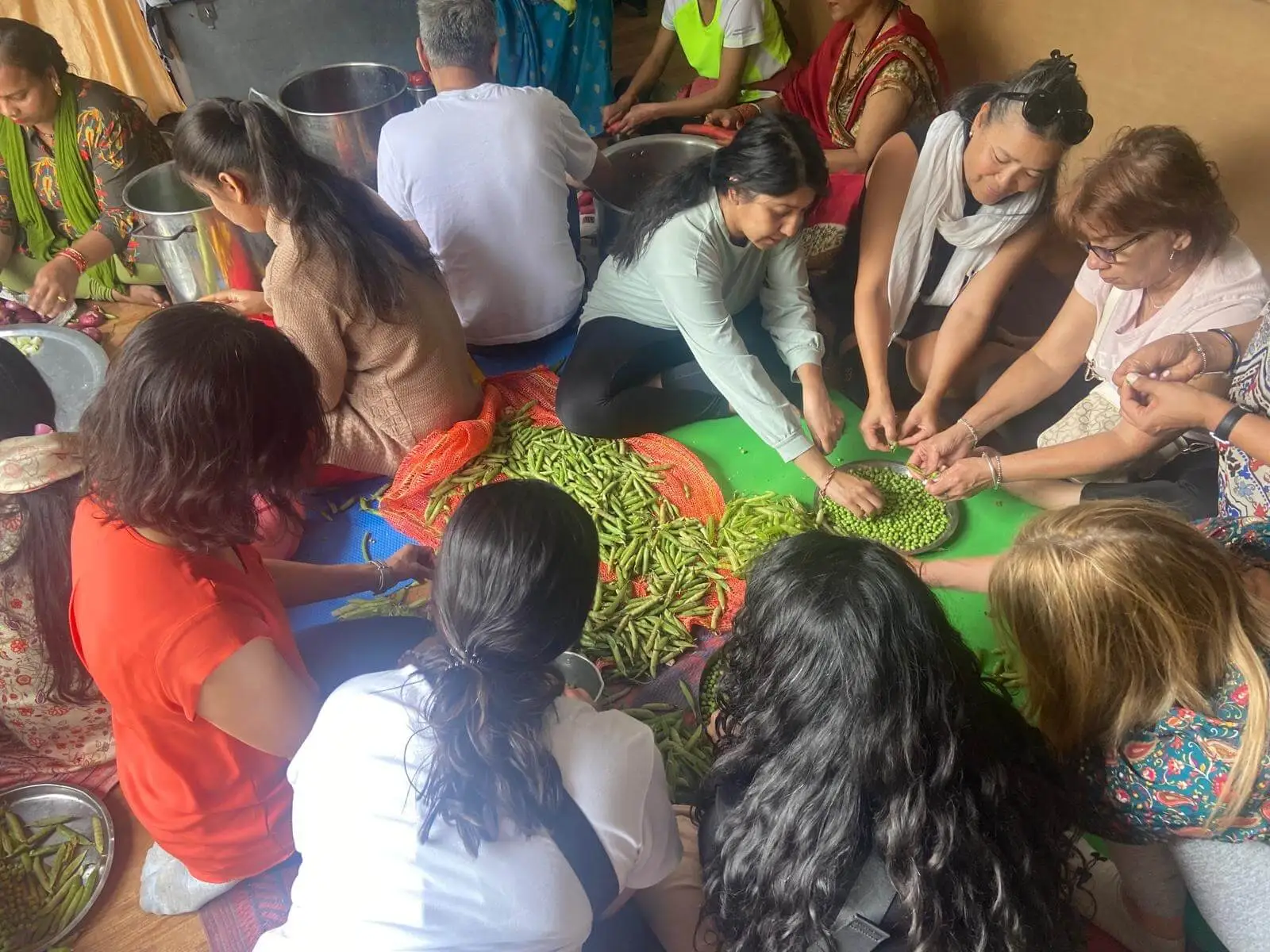 Visitors prepare and serve meals